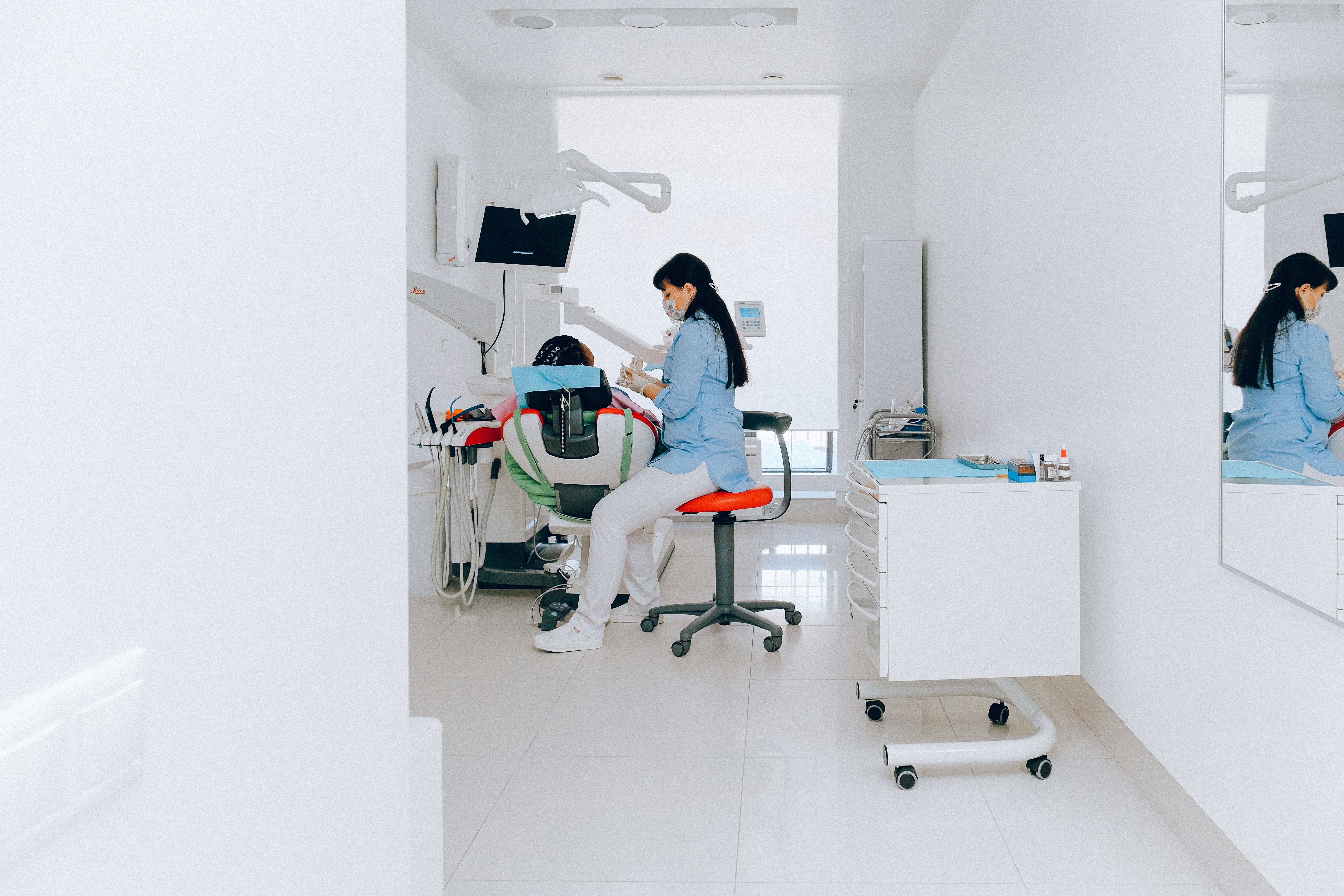 Dentist consulting with patient